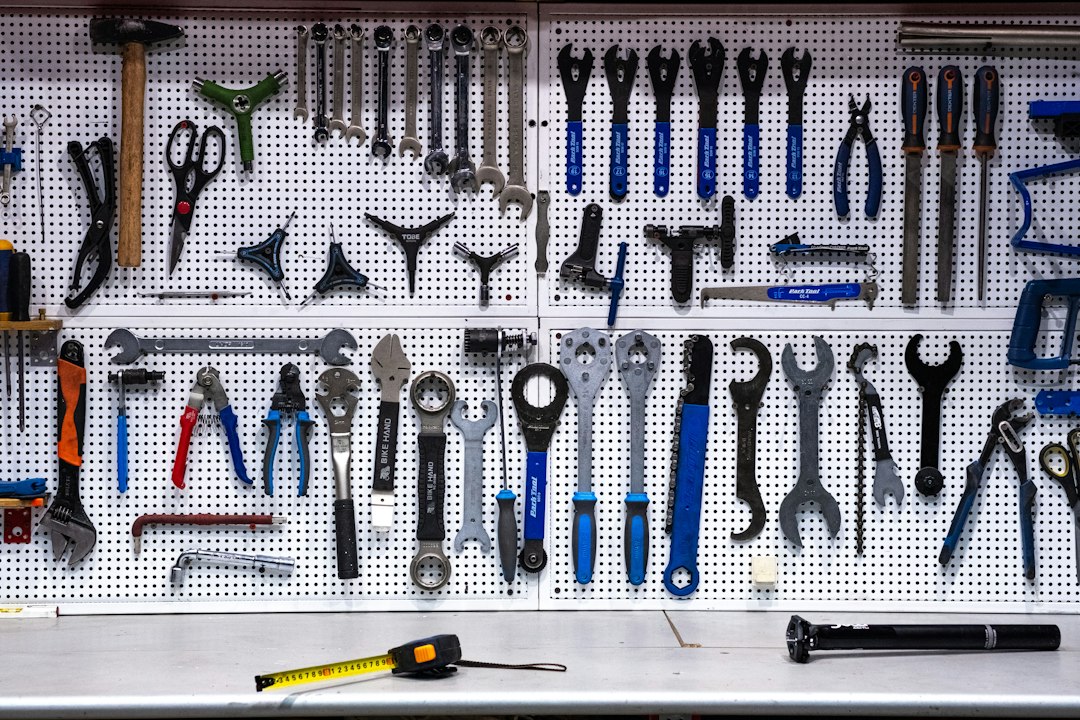 Repair technician tools hanging on a workshop wall