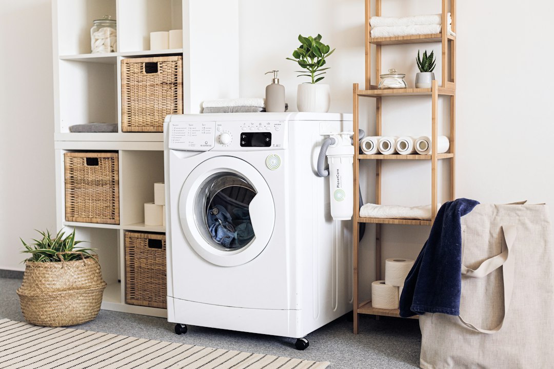 White front-load washing machine in a home laundry room