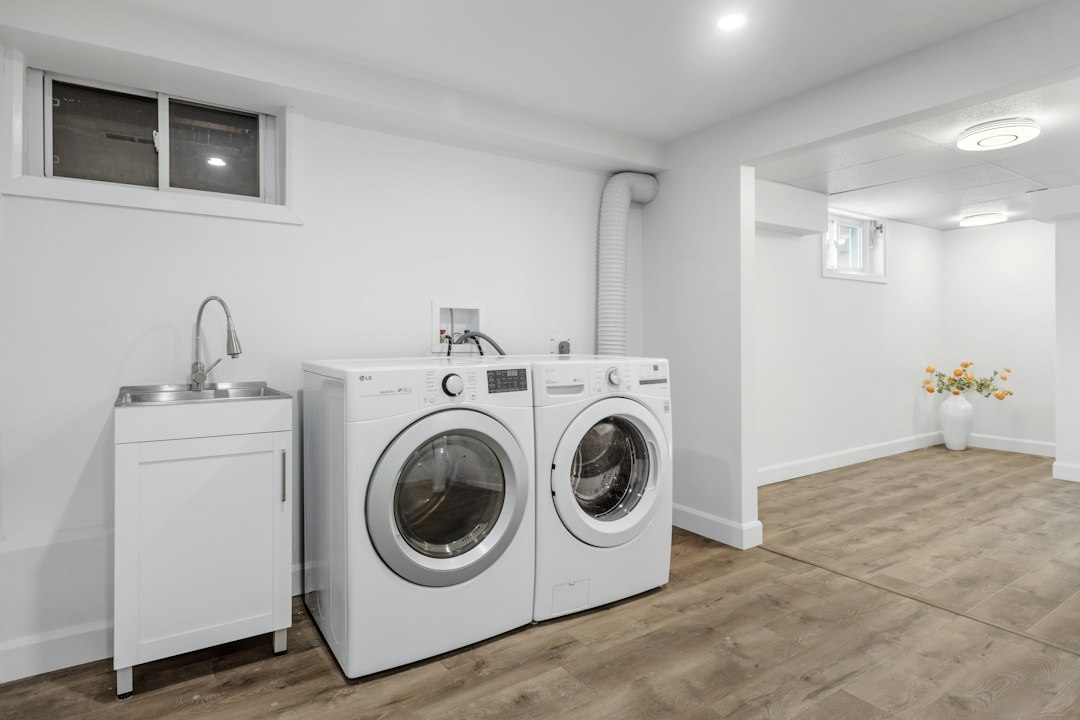 Laundry room with a washer and clothes dryer side by side